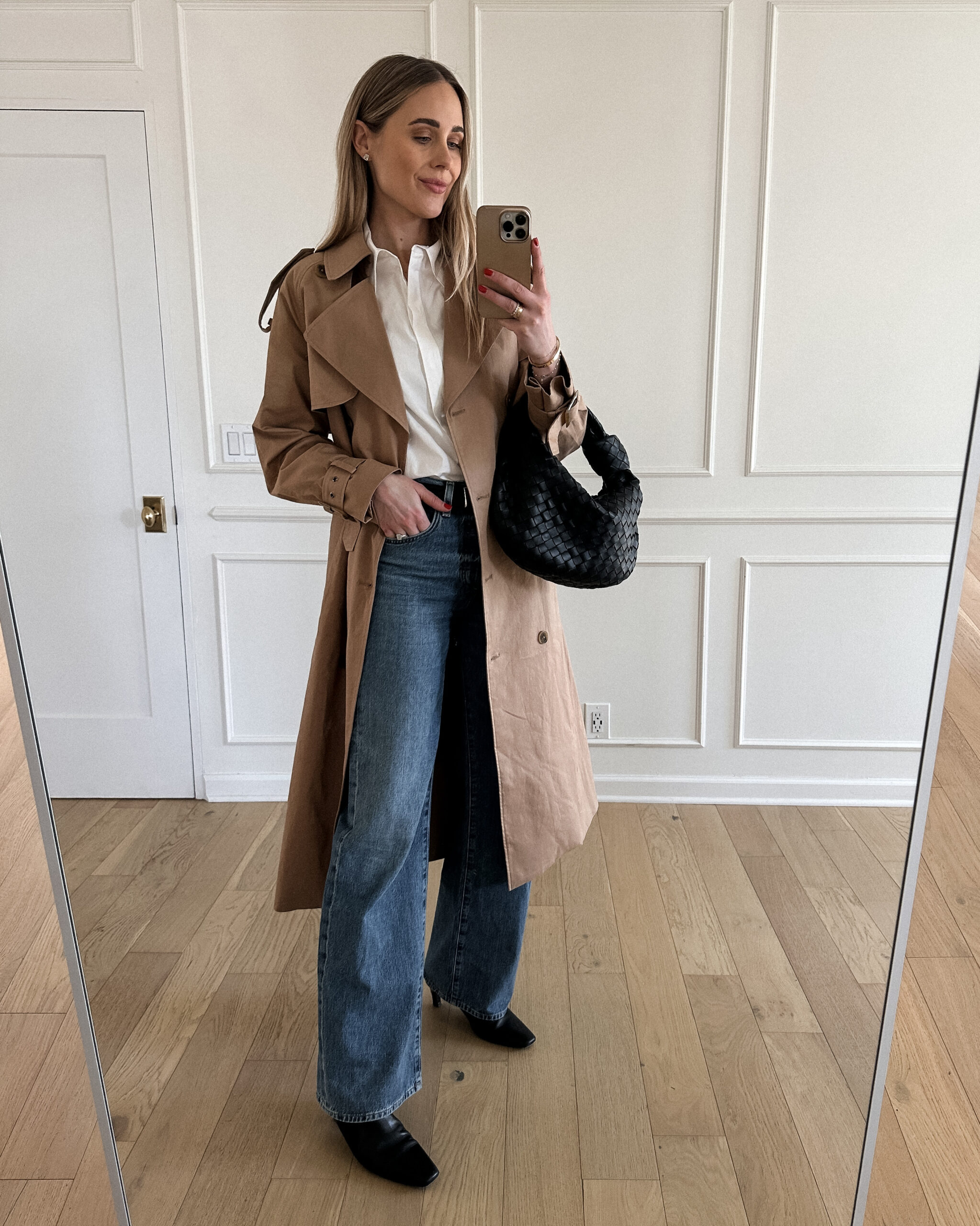 Fashion Jackson Wearing Mayson the label long trench coat, mayson the label white button up shirt, citizens of humanity annina trouser jeans, toteme black booties, bottega veneta teen jodie black
