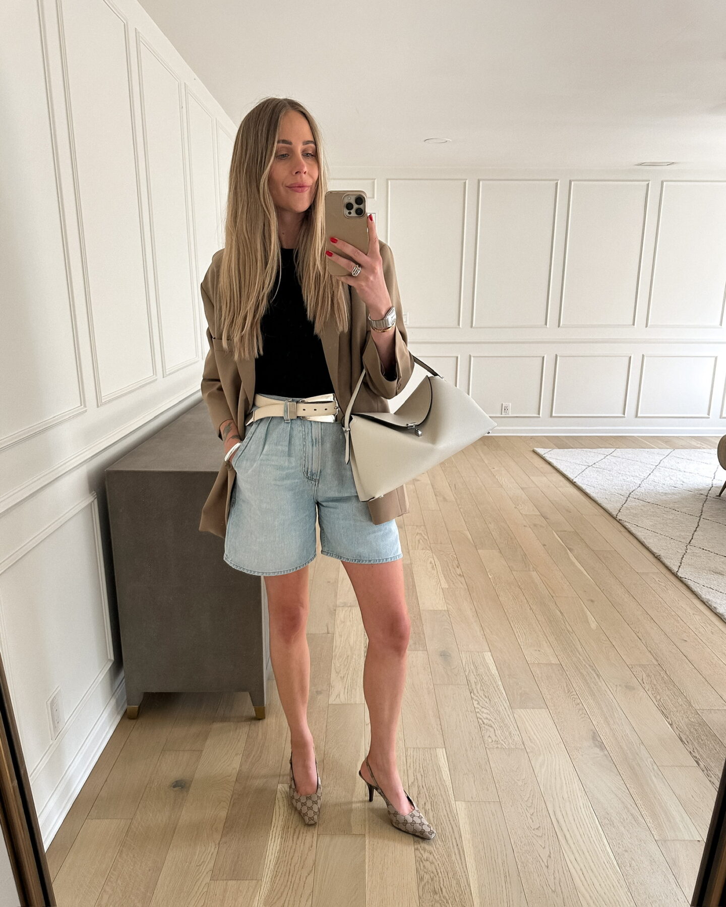 Fashion Jackson wearing Frankie Shop blazer, AGOLDE denim shorts, Gucci slingbacks, KHAITE Lucca belt, Toteme t-lock bag, summer outfit